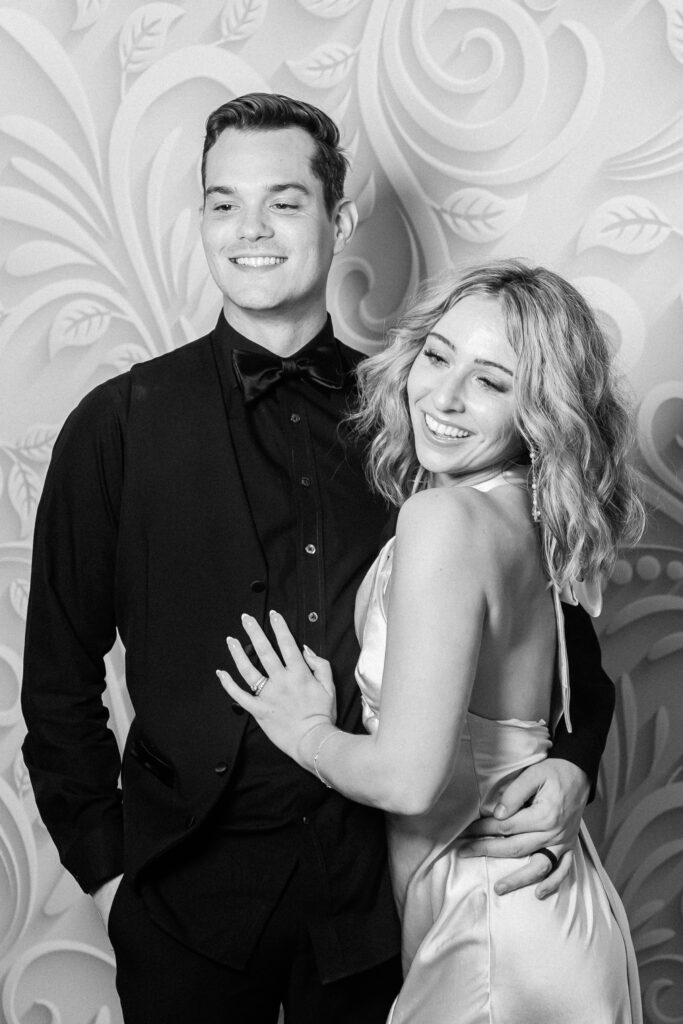 groom in black tux and bride in slip reception gown