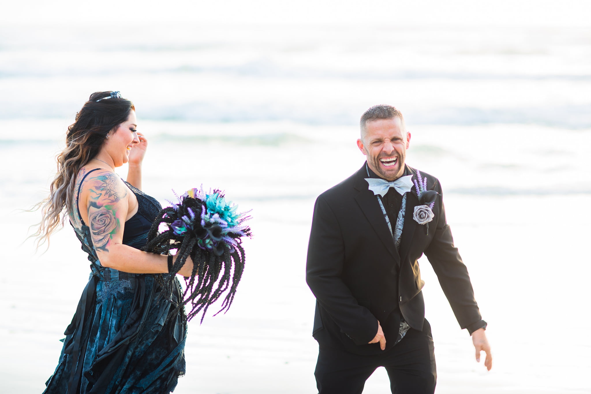 bride in black gown and groom in black tux for Halloween wedding