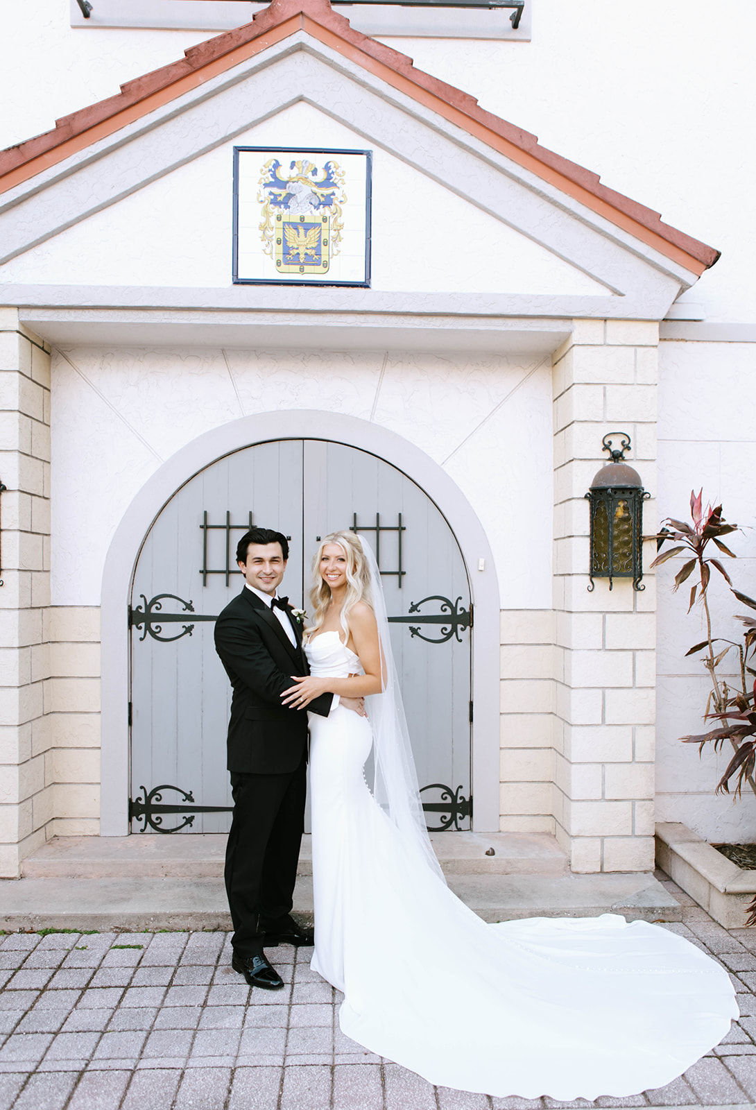 bride and groom outside Bishop Museum of Science