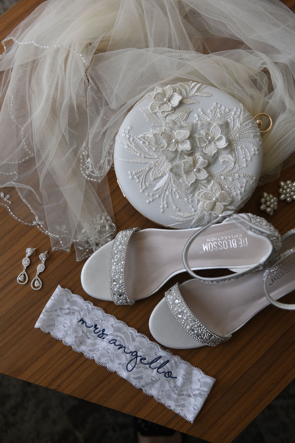 white bridal accessories flatlay