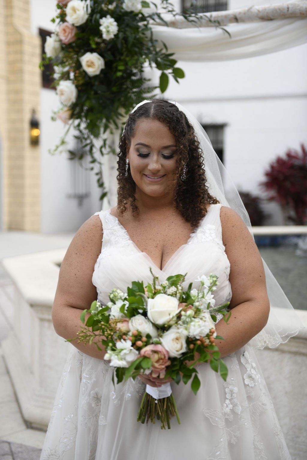 bride in tulle and floral accented wedding gown