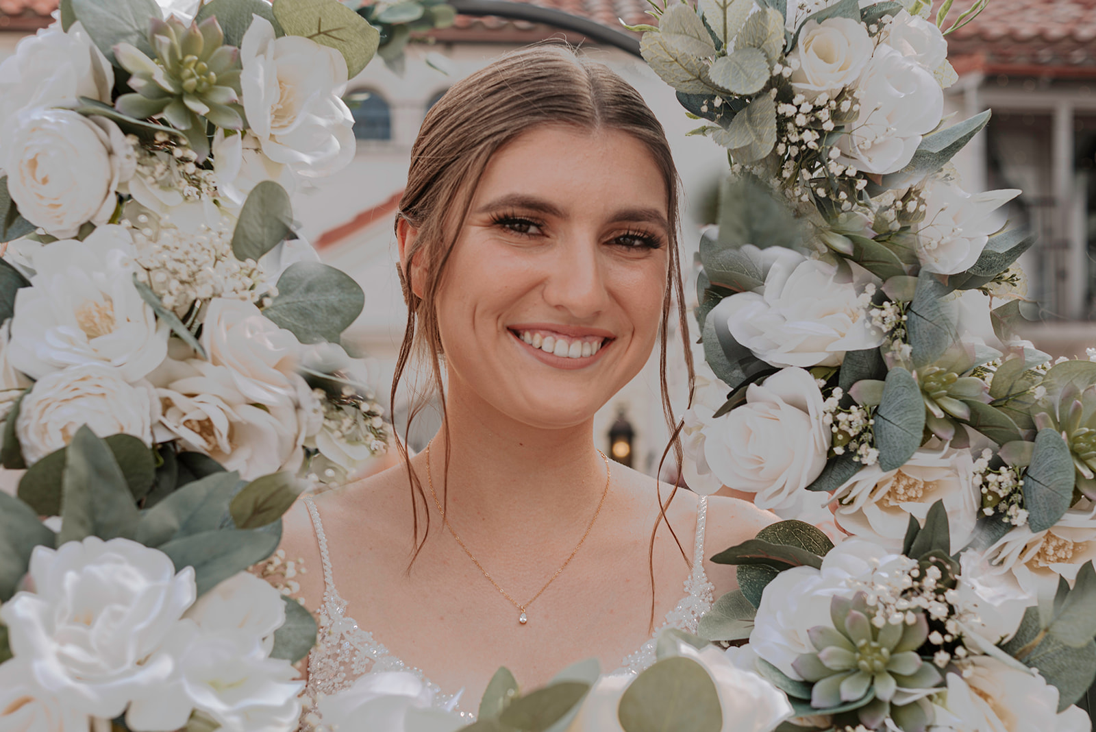 bride surrounded by her bridesmaids bouquets 