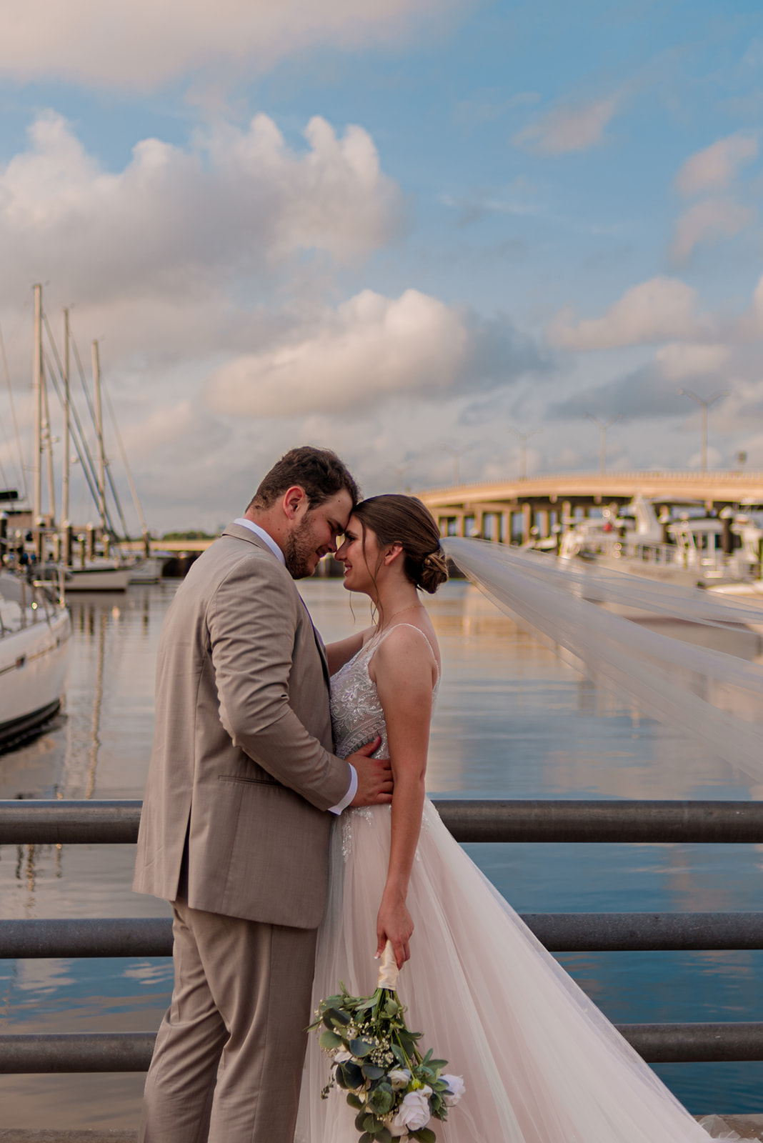 bride and groom waterside portraits at Bishop Museum of Science