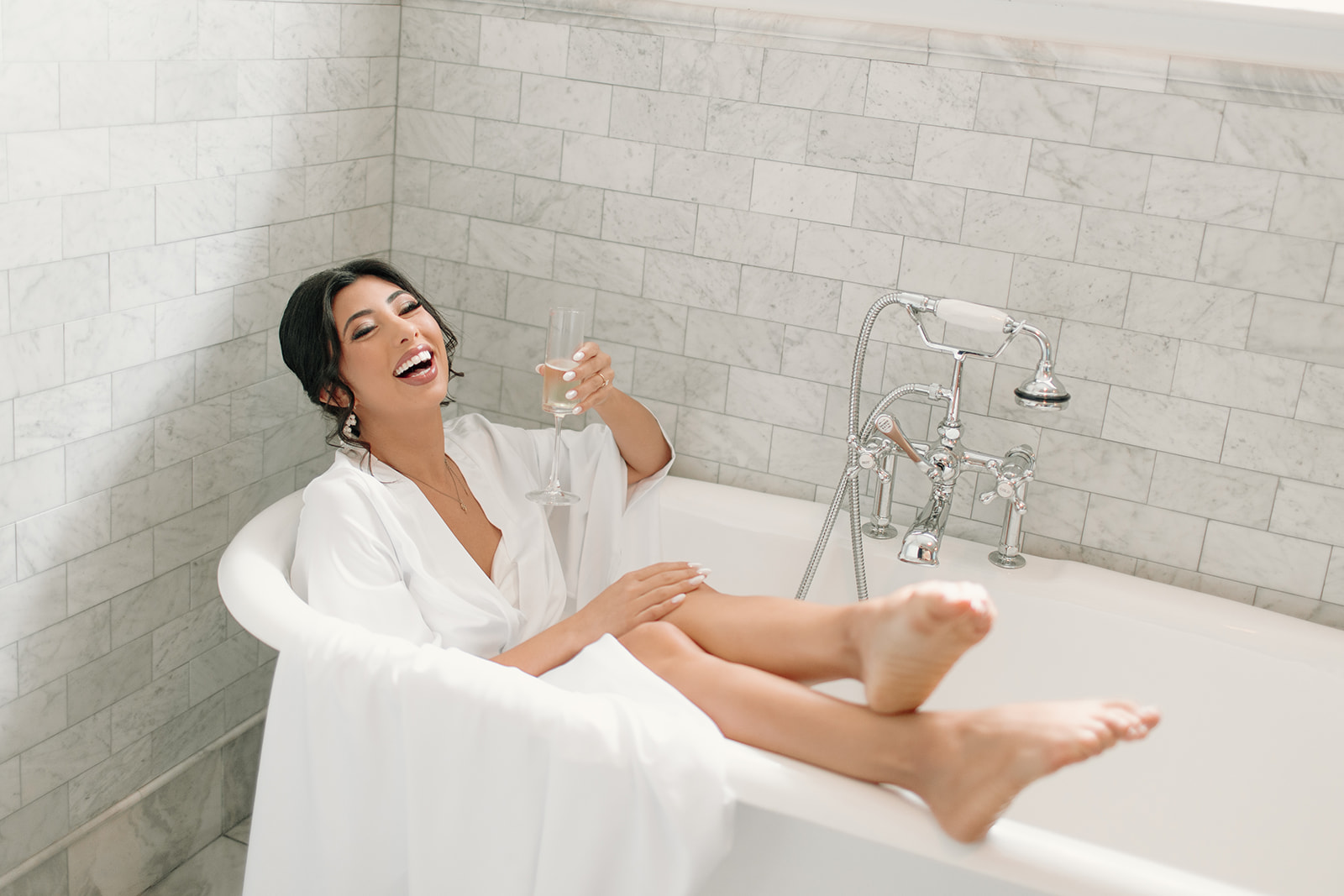 bride in tub with champagne 