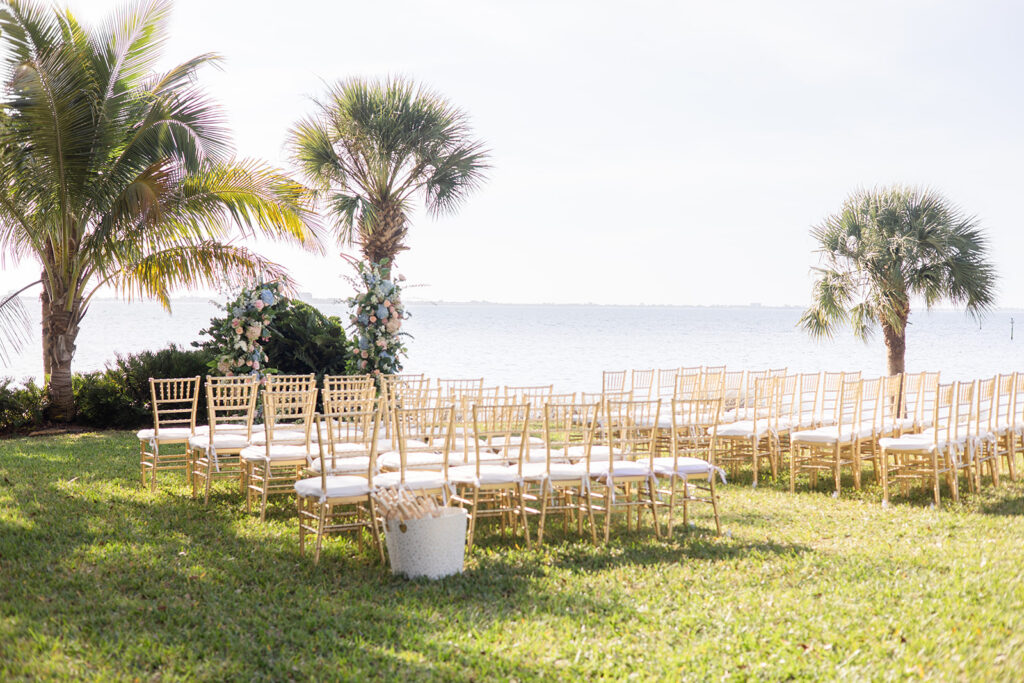 outdoor wedding reception under palm trees at Powel Crosley Estate