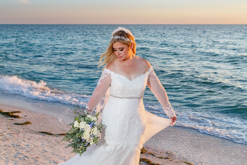 bridal portraits on the beach at Sandcastle Resort